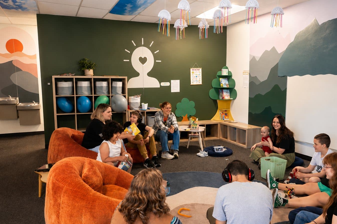 Strides clients and staff gathered together in a community circle